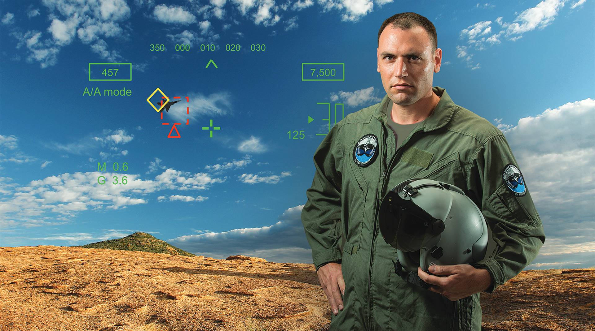 Pilot holding JHMCS II helmet