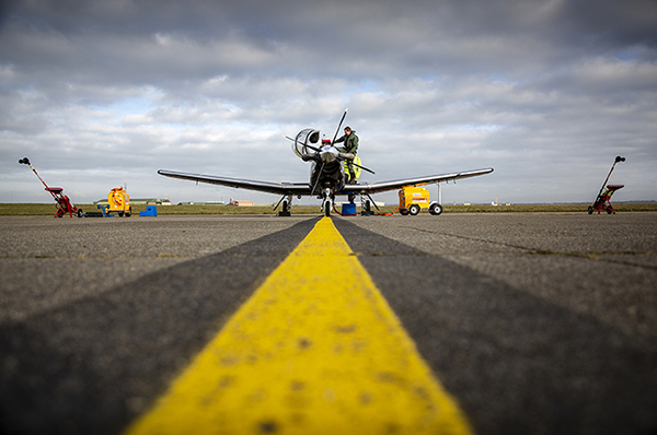 A flight cadet boarding a Texan T-6C aircraft on the runway. Credit: UK MoD Crown Copyright 2019