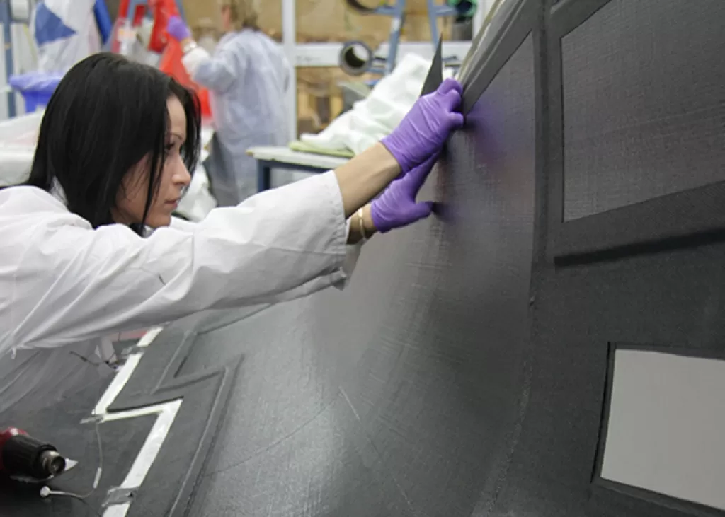 A female engineer checking commercial aircraft parts