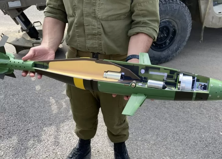 Lt. Col. Liron Cohen holds a cross-section of Israel’s Iron Sting mortar. (Seth Frantzman/Breaking Defense)