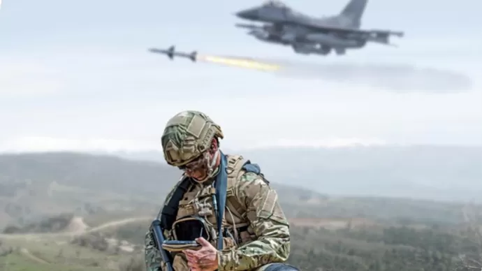 infantry soldier in the field with a fighter aircraft above in the sky